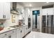Well-equipped kitchen featuring quartz countertops, stainless steel appliances, and white cabinetry at 6005 Coral Berry Rd, Hanahan, SC 29410