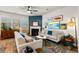 Inviting living room featuring plush seating, fireplace, colorful rug, and curated wall art at 6005 Coral Berry Rd, Hanahan, SC 29410