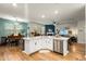 Bright, open living space with a kitchen island and piano at 6005 Coral Berry Rd, Hanahan, SC 29410