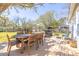 Inviting deck area featuring outdoor dining and seating, perfect for enjoying the backyard's sunny and scenic views at 689 Port Cir, Charleston, SC 29412