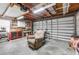 Spacious garage with workbench, tool storage, and overhead lighting, perfect for projects and organization at 689 Port Cir, Charleston, SC 29412