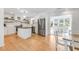 Bright kitchen boasts an island, stainless appliances, white cabinets and an attached dining room with natural light at 689 Port Cir, Charleston, SC 29412