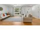 Cozy living room with bright wood floors and a comfortable seating area flooded with natural light at 689 Port Cir, Charleston, SC 29412