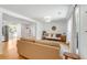 Bright, open-concept living room featuring light wood floors, comfortable seating, and seamless flow to dining at 689 Port Cir, Charleston, SC 29412
