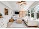 A sunroom living space features a sectional sofa, stylish decor, and exterior views through numerous windows at 689 Port Cir, Charleston, SC 29412
