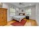 Comfortable bedroom with a twin bed, hardwood floors, and bright natural light at 7 Guerard Rd, Charleston, SC 29407