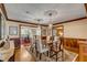 Elegant dining room with hardwood floors, wainscoting, and decorative lighting at 7 Guerard Rd, Charleston, SC 29407