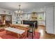 Open kitchen with a spacious island, a dining area with a chandelier, and modern appliances at 7 Guerard Rd, Charleston, SC 29407