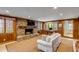 Cozy living room with a brick fireplace, a comfortable sofa, and ample natural light at 7 Guerard Rd, Charleston, SC 29407
