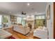 Bright living room with fireplace, hardwood floors, and stylish built-in shelving at 7 Guerard Rd, Charleston, SC 29407