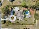 Aerial view of beautiful home on acreage with circular drive and backyard pool at 7858 Gull Bay Dr, Awendaw, SC 29429
