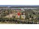 Aerial view showcasing property's location near waterway and the surrounding landscape at 7858 Gull Bay Dr, Awendaw, SC 29429