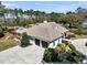 Aerial view of home featuring a three-car garage, neutral roof and landscaped yard at 7858 Gull Bay Dr, Awendaw, SC 29429