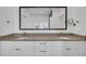 Elegant bathroom featuring a double sink vanity with stone countertops at 7858 Gull Bay Dr, Awendaw, SC 29429