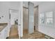 Modern bathroom showcasing a tiled walk-in shower with pebble flooring at 7858 Gull Bay Dr, Awendaw, SC 29429