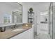 Bright bathroom featuring a marble sink and shower at 7858 Gull Bay Dr, Awendaw, SC 29429
