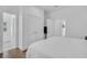 Neutral bedroom featuring hardwood floors and double closets at 7858 Gull Bay Dr, Awendaw, SC 29429