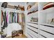 Well-organized walk-in closet with shelving and ample storage for clothes and accessories at 7858 Gull Bay Dr, Awendaw, SC 29429