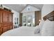Airy main bedroom featuring vaulted ceiling with backyard views and natural light at 7858 Gull Bay Dr, Awendaw, SC 29429