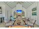 Well-appointed pool house interior featuring a fireplace, bar, and relaxing atmosphere at 7858 Gull Bay Dr, Awendaw, SC 29429