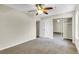 Carpeted bedroom with fan, closet and a doorway at 7875 Sandida Ct, North Charleston, SC 29418