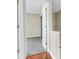 Carpeted bedroom featuring an open door, neutral colored walls and a closet at 7875 Sandida Ct, North Charleston, SC 29418