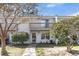 Well-maintained townhome with a cozy second-story balcony and tidy front yard landscaping at 7875 Sandida Ct, North Charleston, SC 29418