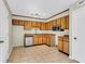 Functional kitchen with wooden cabinets, ceramic tile floors, and a stainless steel dishwasher at 7875 Sandida Ct, North Charleston, SC 29418