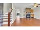 Inviting living area featuring hardwood floors, a stone fireplace, and staircase at 7875 Sandida Ct, North Charleston, SC 29418
