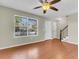 Bright living space boasts hardwood floors and a large window providing lots of natural light at 7875 Sandida Ct, North Charleston, SC 29418