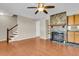 Comfortable living area features hardwood floors and a stone fireplace at 7875 Sandida Ct, North Charleston, SC 29418