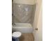 Bathroom with a combined tub and shower featuring elegant tile work and modern fixtures at 7945 Edgebrook Cir # B, North Charleston, SC 29418