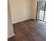 Bedroom featuring modern floors and a sliding glass door that fills the space with natural light at 7945 Edgebrook Cir # B, North Charleston, SC 29418
