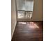 Bright living room featuring large window with natural light and modern floors, creating a welcoming space at 7945 Edgebrook Cir # B, North Charleston, SC 29418