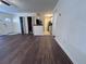 Spacious living room featuring modern floors that flow into the kitchen area with ample space for entertaining at 7945 Edgebrook Cir # B, North Charleston, SC 29418