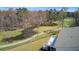 Scenic backyard view overlooking a tranquil pond and golf course providing a serene and picturesque setting at 8638 Scottish Troon Ct, North Charleston, SC 29420