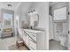 Bright bathroom featuring a vanity with marble countertops, a window for natural light, and a toilet room at 8638 Scottish Troon Ct, North Charleston, SC 29420