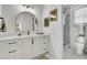 Elegant bathroom featuring a marble countertop vanity, gold-framed mirror, and glass-enclosed shower at 8638 Scottish Troon Ct, North Charleston, SC 29420
