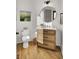 Chic half-bathroom featuring a rustic vanity, modern fixtures, and stylish decor at 8638 Scottish Troon Ct, North Charleston, SC 29420
