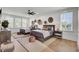Bedroom featuring two beds, neutral decor, and lots of natural light from large windows at 8638 Scottish Troon Ct, North Charleston, SC 29420