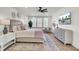 Bright bedroom with a ceiling fan, hardwood floors, neutral decor, and a large dresser at 8638 Scottish Troon Ct, North Charleston, SC 29420