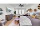 Bedroom featuring two beds, flat-screen TV, stylish decor, and lots of natural light at 8638 Scottish Troon Ct, North Charleston, SC 29420