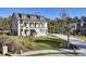Charming two-story home featuring a welcoming porch, well-manicured lawn, and a private driveway at 8638 Scottish Troon Ct, North Charleston, SC 29420