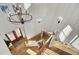 Bright foyer with a wooden staircase, chandelier, and paneled walls, offering a welcoming entrance at 8638 Scottish Troon Ct, North Charleston, SC 29420