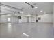 Spacious three-car garage with epoxy flooring, ample lighting, and a clean, organized layout at 8638 Scottish Troon Ct, North Charleston, SC 29420
