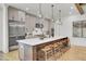 Large kitchen island with seating, stainless steel appliances and modern finishes at 8638 Scottish Troon Ct, North Charleston, SC 29420