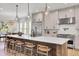 Modern kitchen with island seating, stainless steel appliances, and natural light at 8638 Scottish Troon Ct, North Charleston, SC 29420