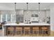Bright kitchen with large island, pendant lighting, and stainless steel appliances at 8638 Scottish Troon Ct, North Charleston, SC 29420