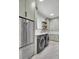 Functional laundry room with modern appliances, ample counter space, and stylish cabinetry at 8638 Scottish Troon Ct, North Charleston, SC 29420