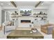 Cozy living room with fireplace, built-in shelves, and comfortable seating arrangement at 8638 Scottish Troon Ct, North Charleston, SC 29420